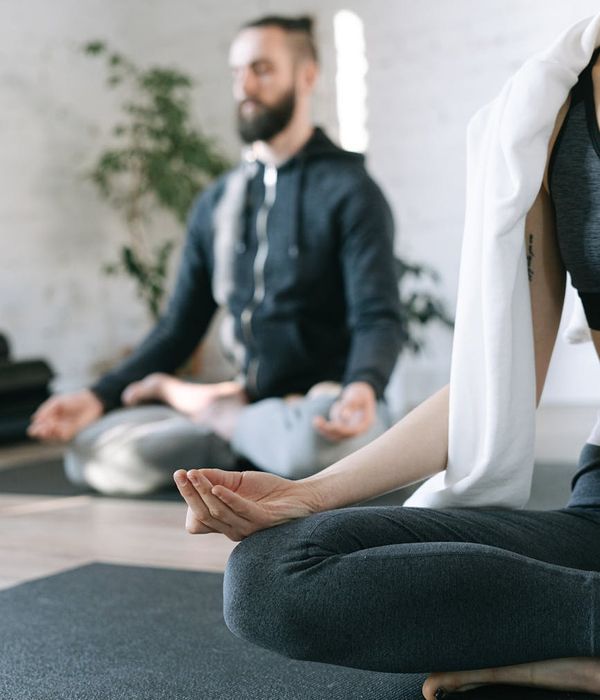 Person practicing eye relaxation techniques in a cozy environment